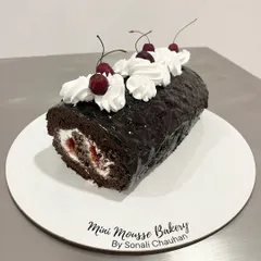 A full view of my Black Forest Swiss Roll. This dessert brings back so many childhood memories with its classic combination of chocolate, cream, and cherries.