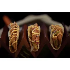 Introducing the Korean Avocado Taco. Crispy avocado and fresh veggies are tucked into a fluffy taco shell and drizzled with our special sauce for a perfect fusion bite.