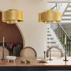 The finished dining area, looking towards the staircase. The transformation from a construction site to a warm, inviting home with layered lighting and textures is what our full-service design process is all about.