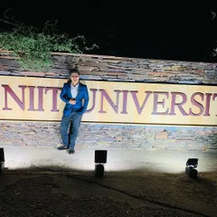 A proud moment for me, levitating outside the gates of NIIT University in Rajasthan after a performance. College shows are one of my favorite gigs, and I always leave feeling inspired by the students.