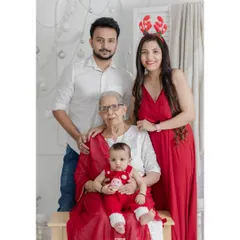 Three generations of love. This beautiful Christmas portrait includes dadi (grandmother), capturing a precious multi-generational family moment.