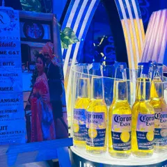 We design custom menus that tell a story. This menu for "Rajiv and Ekta's Cocktails" features drinks named after their journey, like "You & Me G&T" and "Love Bite," alongside a photo of the couple.
