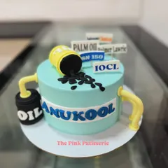 This is a highly conceptual sculpted cake designed for a client in the petroleum industry. It incorporates multiple brand logos and industry-specific elements like oil drums and pipes, all made from fondant.