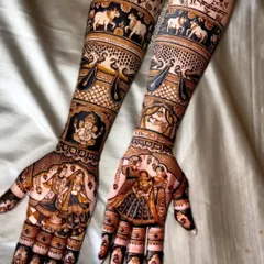 A perfect example of our full-coverage traditional bridal mehandi. This design features incredibly detailed figures, including a varmala scene, Lord Ganesha for blessings, and bands of elephants and swans, all executed with fine lines and perfect symmetry.
