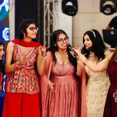 Engaging with the bride's squad on stage. Making the couple's friends and family part of the show makes the event more personal and fun.