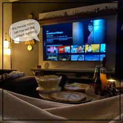 It's movie time! Your smart home knows to dim the lights to create the perfect cinematic experience, so you can focus on the popcorn and the film.