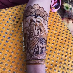 The divine grace of Radhe Krishna. This arm design was created for a spiritual soul, capturing the eternal love and connection between Radha and Krishna under a beautiful tree.