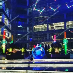 I can transform large outdoor spaces for national celebrations. Here, I used custom lighting fixtures and large Ashoka Chakra installations to create a powerful and patriotic display for an Independence Day event at a corporate campus.