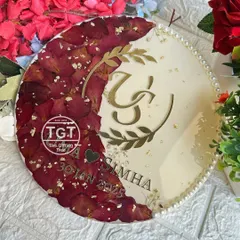 Another angle of the round resin frame, showing the shimmery ivory base that makes the red rose petals and gold accents stand out.