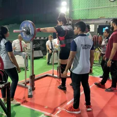 Pooja setting up for a squat at the National Open Championship. She suffers from Thoracic Endometriosis, which causes significant pain and breathing difficulty. We work around her health, managing her training to allow her to compete at the highest level.