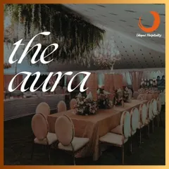 The right aura can make a celebration unforgettable. This image showcases an elegant dining setup for a special occasion, with beautiful table settings and hanging floral decor, reflecting the premium ambiance we create.