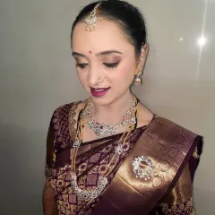 A soft and elegant makeover for an after-wedding ritual. I used subtle eyeshadow and a mauve lip to complement her beautiful diamond jewelry and rich purple silk saree.