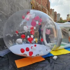 This angle shows the attached inflatable entry tunnel, which keeps the main dome inflated while people go in and out. The entire structure is made from durable, high quality transparent material.