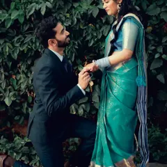 A classic proposal shot, capturing the emotion as he gets down on one knee.