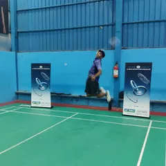 **Testing the New Gear.** An athlete executing a powerful jump smash while testing out a new Yonex racket during the demo day.