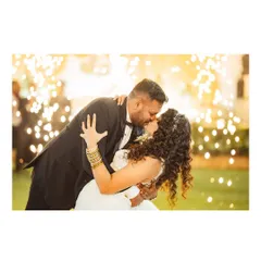 A romantic kiss against a backdrop of dazzling sparklers. This is a perfect, magical shot to capture during the wedding reception.