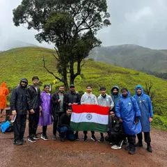 Celebrating Independence Day on a trek, holding the Indian flag with pride. We love sharing these special moments with our community.