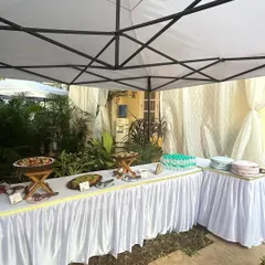 An outdoor brunch setup for a kid's birthday. I use canopies to create a comfortable and shaded area for the food, ensuring everything stays fresh and appealing.