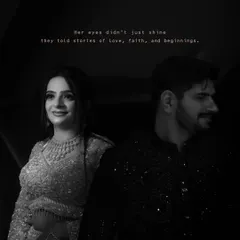 A beautiful black and white shot of Rishul and Vanshika, capturing a candid moment of love and connection.