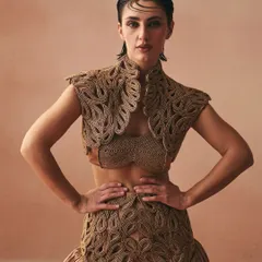 From my 'Cord Memory' collection, this ensemble is a testament to texture. I handcrafted the corded zari jacket and placement embroidery on the skirt to feel like inherited bonds made tangible. The design merges a satin bralette with a voluminous skirt, creating a silhouette that is both fierce and feminine.