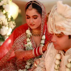 A candid shot during the ceremony. The makeup is subtle yet defining, ensuring the bride looks her absolute best during these precious, once-in-a-lifetime moments.