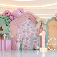 Welcome to "Aahana's Onderland," a whimsical first birthday party where every detail was crafted to inspire wonder. This custom-fabricated backdrop, with its soft pastel balloons and floral-print panels, set the stage for a magical celebration.