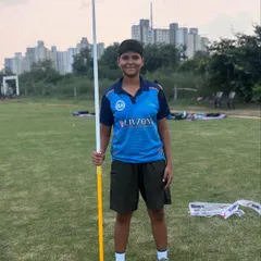 A young javelin thrower stands ready for practice. We equip our athletes with professional gear to ensure they train to the highest standards.