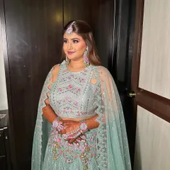 Crafting a radiant glow for Riddhi's mehendi. I used soft pinks on her eyes and lips to complement the colorful embroidery on her mint green lehenga.