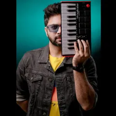 A professional portrait with my midi keyboard. This image celebrates my identity as a musician and producer, perfect for World Music Day.