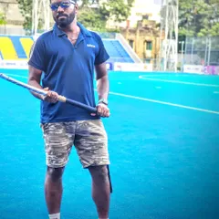 Standing on the turf, stick in hand. I believe success starts with self-belief. I work to instill that confidence in every athlete I train, helping them embrace challenges and conquer their goals.