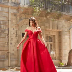 Feel like you're in a fairytale with this show-stopping red off-the-shoulder ball gown. It's the perfect rental for a grand reception, a black-tie event, or any night you want all eyes on you.