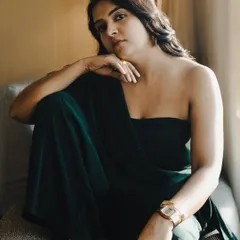 A relaxed portrait showcasing the versatility of the look. This jumpsuit can easily transition from a day event to an evening function, making it a valuable addition to a professional's wardrobe.