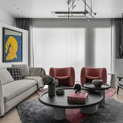 Another view of the art-focused living room, as seen in India Today Home. The arrangement of furniture, including the modern armchairs and abstract lighting, is designed to facilitate both conversation and appreciation of the surrounding art pieces.