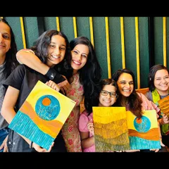 A group of happy participants with their finished Wabi Sabi paintings. Each piece is a unique expression of finding beauty in imperfection.