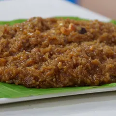 Our Sakkare Pongal served on a traditional banana leaf. This sweet dish is a symbol of harvest and happiness, and we cook it slowly to achieve the perfect creamy consistency and rich flavour.