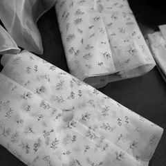 The process begins with beautiful materials. Here, delicate printed tissue paper is ready to be used for a Roka order, ensuring that even the unseen layers of the gift are crafted with care and elegance.