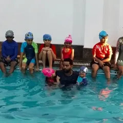 Another group shot capturing the smiles and camaraderie of our summer camp swimmers.