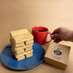 Our signature shortbread biscuits are simple, buttery, and nostalgic. Made with just flour, butter, sugar, and salt, they are the perfect companion for your tea or coffee.