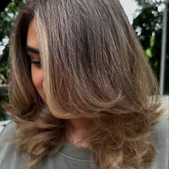 Another look at my 'Vanilla Butter Cream' creation. This is a fantastic way to blend grey hair into a stylish, modern blonde look. The ash tones help neutralize any brassiness for a cool, creamy finish.