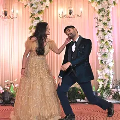 It's all about having fun together. This playful moment from a couple's routine shows that the best wedding dances are the ones filled with laughter and your unique personality.