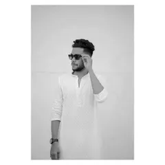 A minimalist black and white portrait. The stark background and the simple action of adjusting his sunglasses create a cool, confident, and modern look.