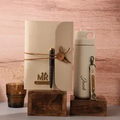 This elegant gift set for 'Jacob' includes a personalized journal with a leather tie and a matching insulated flask, perfect for a colleague or loved one.