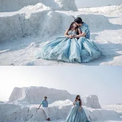 Celebrating love with our happy clients on their pre-wedding shoot. She looks like a dream in our dusty blue ball gown against the stunning white landscape.