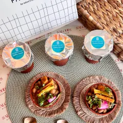 My signature Kulhad Chole Chawal is now available for home delivery. This image shows the dish served alongside the conveniently packed kulhads, ready to be heated and enjoyed in the comfort of your home.