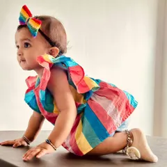Moments like this are what I cherish most. Here is an adorable little customer looking so sweet in our handmade crochet rainbow bow. We design our newborn headbands to be extra soft and gentle on delicate skin.