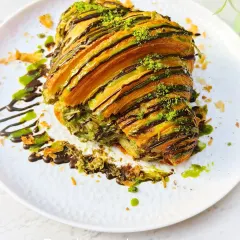 This is my Pistachio Croissant, a sophisticated treat for those who love nutty flavours. It's filled with a rich pistachio cream and finished with a drizzle of chocolate and a sprinkle of pistachio dust.