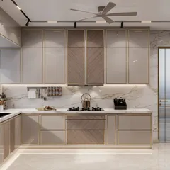The cooking area in this kitchen is designed with sleek, handleless cabinets and a combination of glossy and textured finishes. The golden profiles add a touch of elegance to the minimalist design.