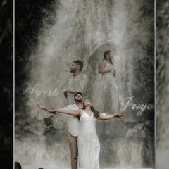 A creative double exposure pre-wedding photo with a stunning waterfall as the backdrop. This artistic shot blends multiple moments into one, telling a story of love and nature.
