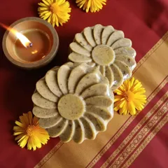 The warm glow of a diya next to my Abhyangasnan Ubtan Soap. This bar is perfect for infusing your gifting hampers with tradition and wellness.