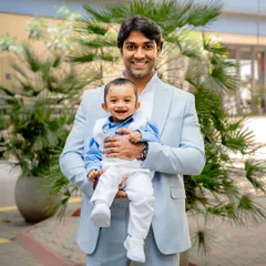 A proud father with his smiling son. We aim to capture relaxed and natural portraits of family members throughout the event, preserving these happy memories for you.